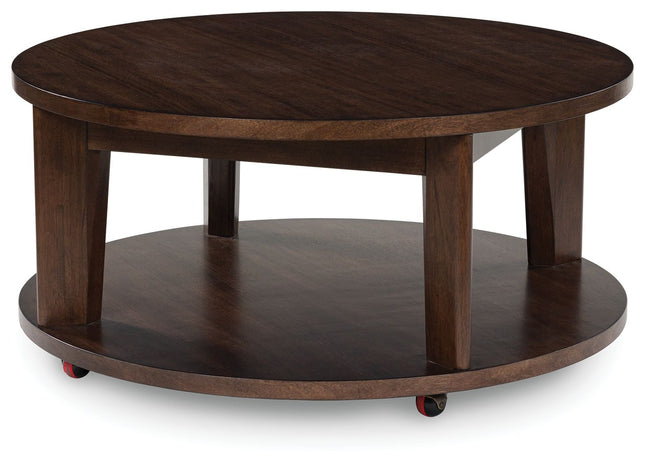 Korestone 2 - Dark Brown - Round Cocktail Table Signature Design by Ashley® 