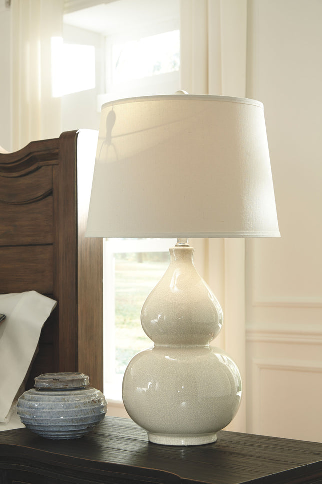 Saffi - Cream - Ceramic Table Lamp Ashley Furniture 