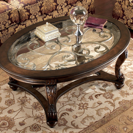 Norcastle - Dark Brown - Oval Cocktail Table Ashley Furniture 