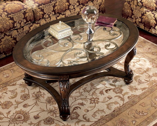 Norcastle - Dark Brown - Oval Cocktail Table Ashley Furniture 