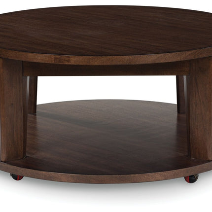 Korestone 2 - Dark Brown - Round Cocktail Table Signature Design by Ashley® 