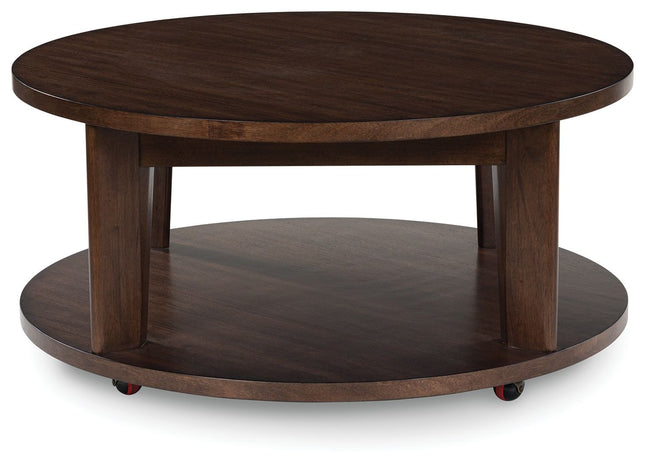 Korestone 2 - Dark Brown - Round Cocktail Table Signature Design by Ashley® 