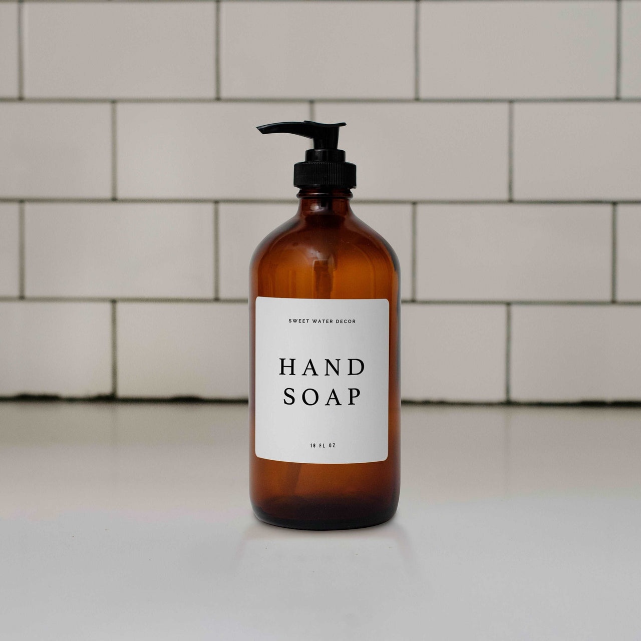 16oz Amber Glass Hand Soap Dispenser - White Text Label Tony's Home Furnishings Furniture. Beds. Dressers. Sofas.