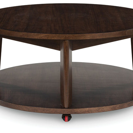 Korestone 2 - Dark Brown - Round Cocktail Table Signature Design by Ashley® 