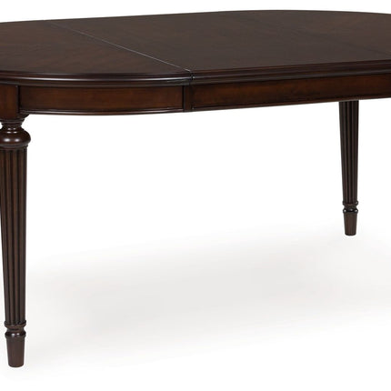 Lavinton - Brown - Oval Dining Room Extension Table Signature Design by Ashley® 