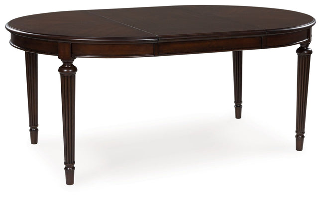 Lavinton - Brown - Oval Dining Room Extension Table Signature Design by Ashley® 