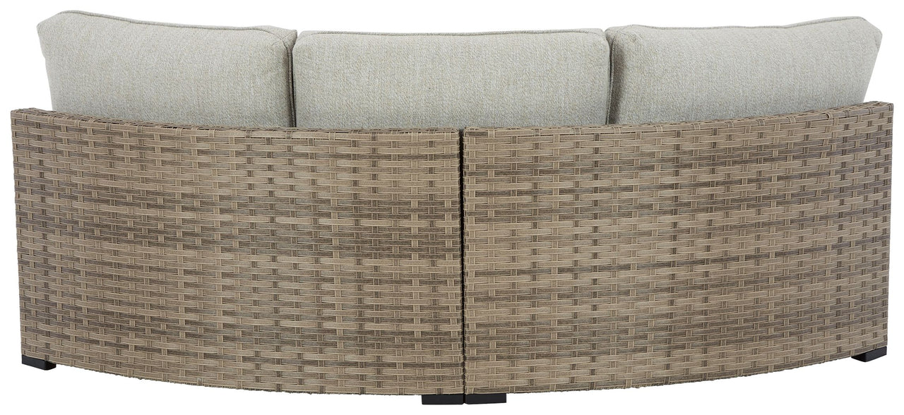 Calworth - Beige - Curved Loveseat With Cushion - Tony's Home Furnishings