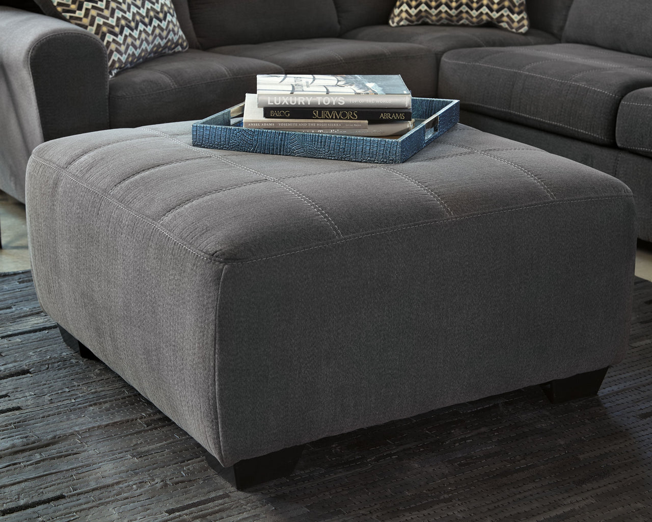 Ambee - Slate - Oversized Accent Ottoman Tony's Home Furnishings Furniture. Beds. Dressers. Sofas.