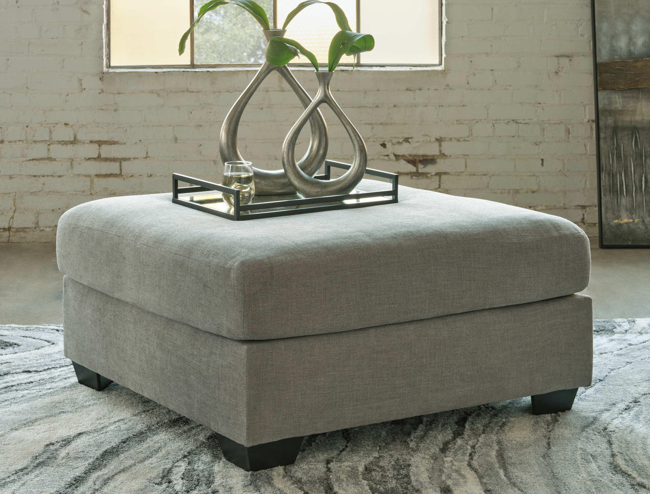 Keener - Ash - Oversized Accent Ottoman Tony's Home Furnishings Furniture. Beds. Dressers. Sofas.