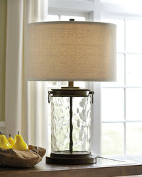 Thumbnail for Tailynn - Clear / Bronze Finish - Glass Table Lamp Tony's Home Furnishings Furniture. Beds. Dressers. Sofas.