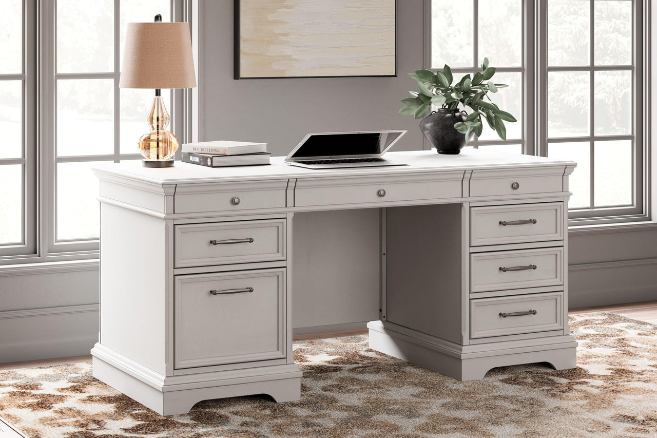 Kanwyn - Whitewash - Home Office Desk With Eight Drawers Tony's Home Furnishings Furniture. Beds. Dressers. Sofas.