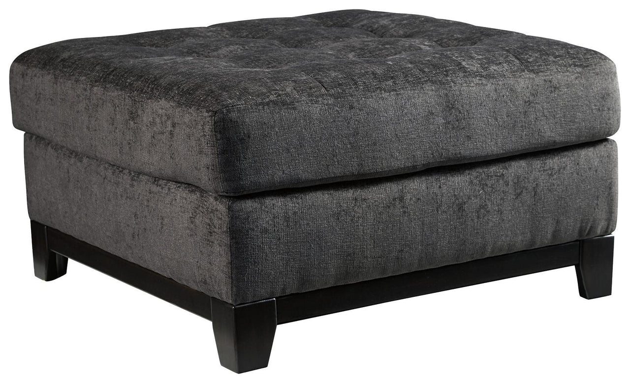 Reidshire - Steel - Oversized Accent Ottoman Tony's Home Furnishings Furniture. Beds. Dressers. Sofas.