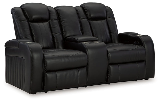 Caveman Den - Midnight - Power Reclining Loveseat With Console/ Adj Hdrst - Tony's Home Furnishings