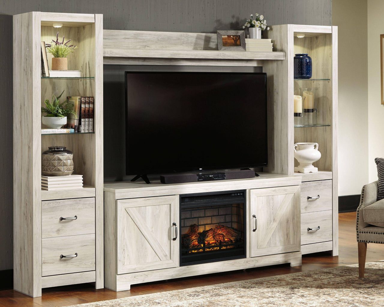 Bellaby - Whitewash - Entertainment Center - TV Stand With Faux Firebrick Fireplace Insert Tony's Home Furnishings Furniture. Beds. Dressers. Sofas.