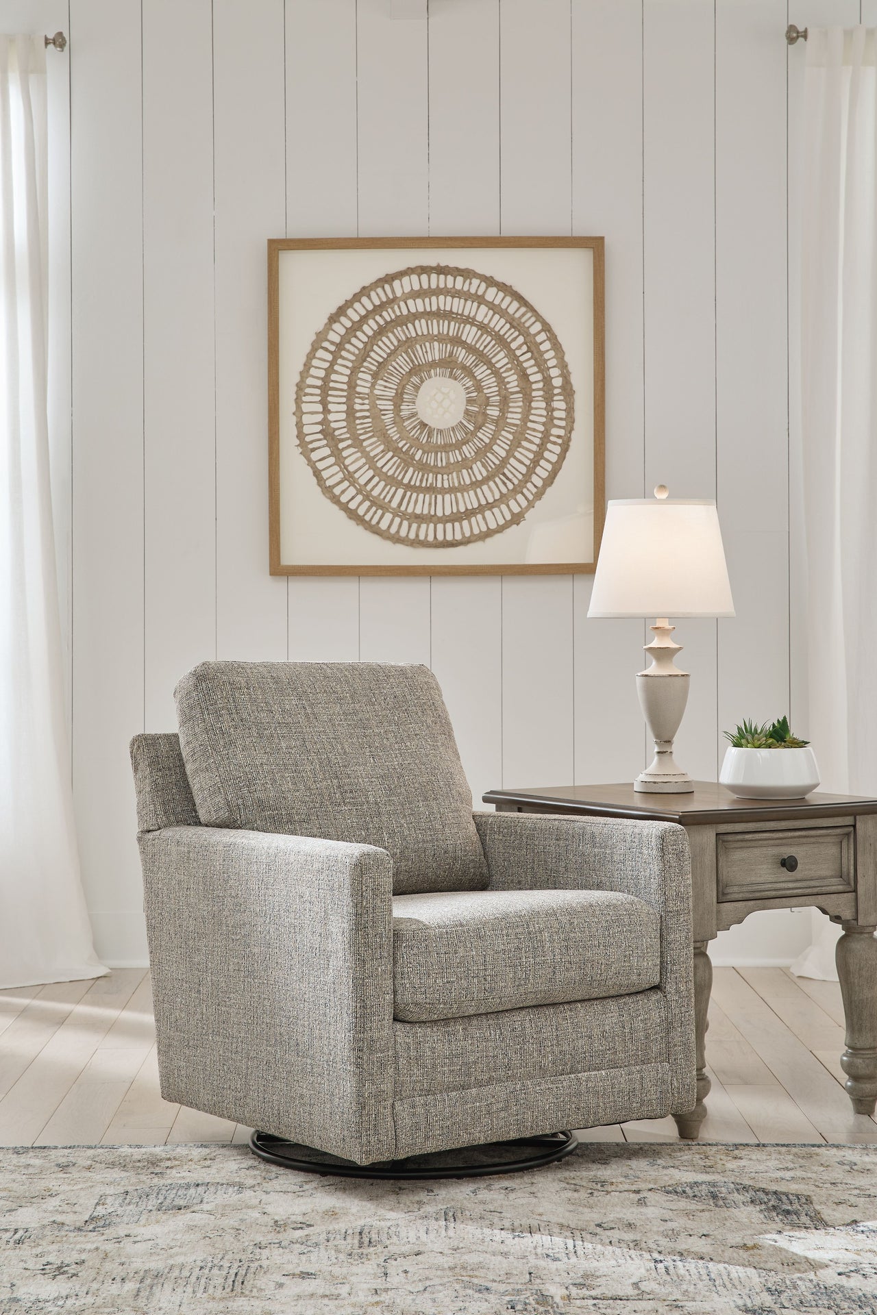 Bralynn - Linen - Swivel Glider Accent Chair Tony's Home Furnishings Furniture. Beds. Dressers. Sofas.