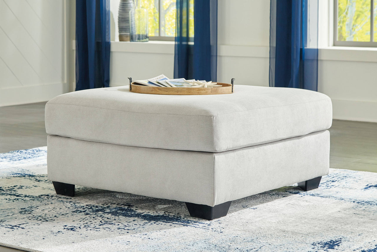 Lowder - Stone - Oversized Accent Ottoman Tony's Home Furnishings Furniture. Beds. Dressers. Sofas.