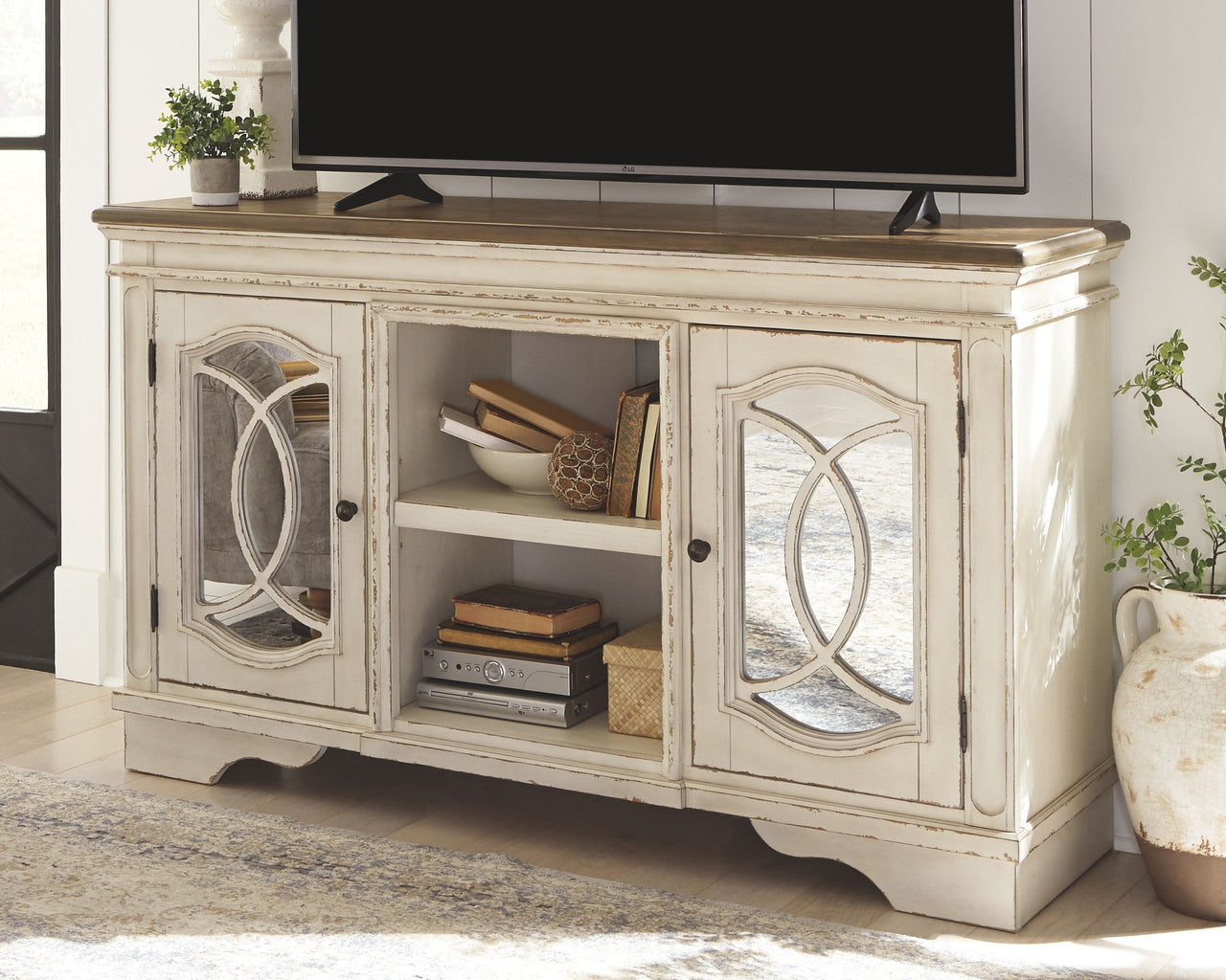Realyn - TV Stand Tony's Home Furnishings Furniture. Beds. Dressers. Sofas.